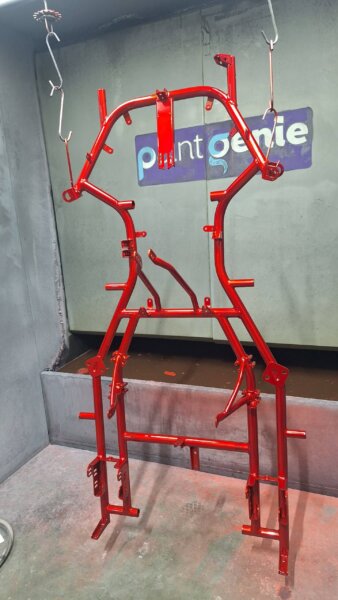 A bright neon green go-kart chassis after a professional powder coating service at Paint Genie in King's Lynn.